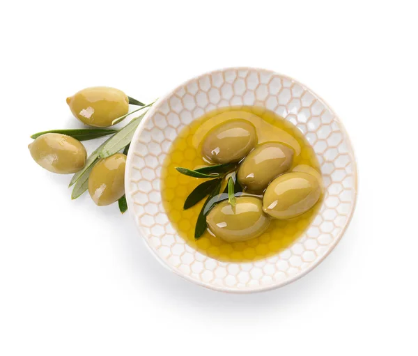 Bowl of tasty olive oil on white background — Stock Photo, Image