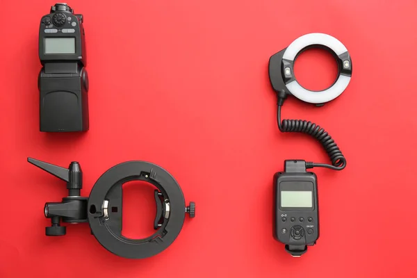Modern equipment of professional photographer on color background — Stock Photo, Image