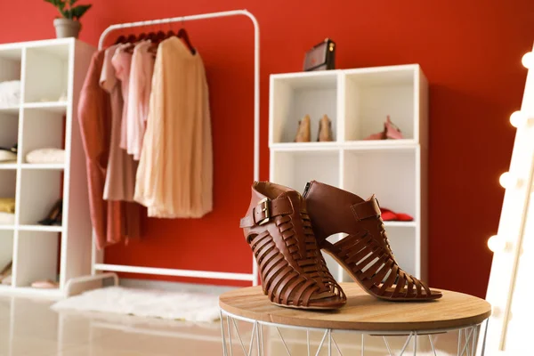 Stylish female shoes on table in dressing room — Stock Photo, Image