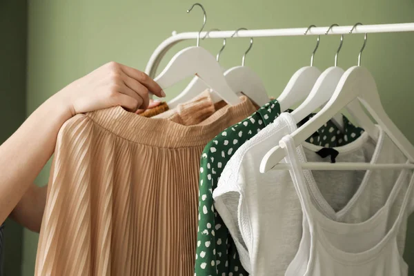 Woman choosing clothes in dressing room — Stock Photo, Image