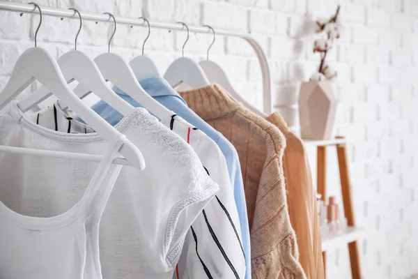 Rack with stylish clothes in dressing room — Stock Photo, Image