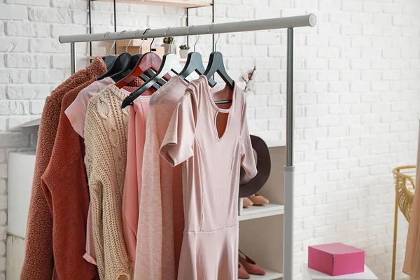 Rack with stylish clothes in dressing room — Stock Photo, Image