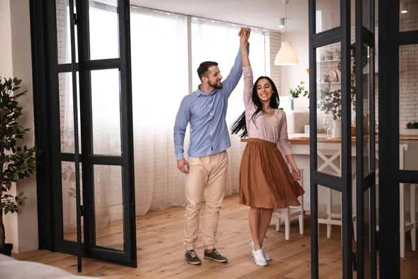 Happy young couple dancing at home — Stock Photo, Image