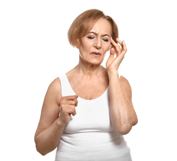 Beautiful mature woman suffering from head ache against white background — Stock Photo, Image