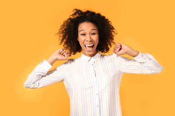 Happy African-American woman on color background