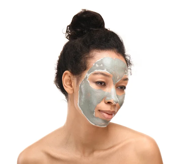Young African-American woman with mask on her face against white background — Stock Photo, Image