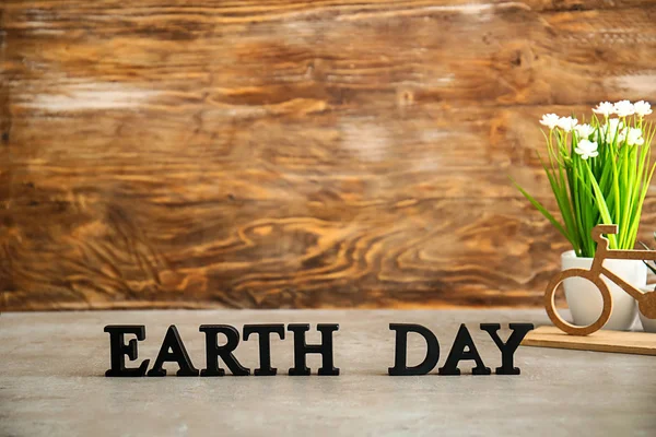 Text EARTH DAY composed from letters on table — Stock Photo, Image