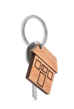 Beyaz arka plan üzerinde ev şeklinde biblo ile anahtar