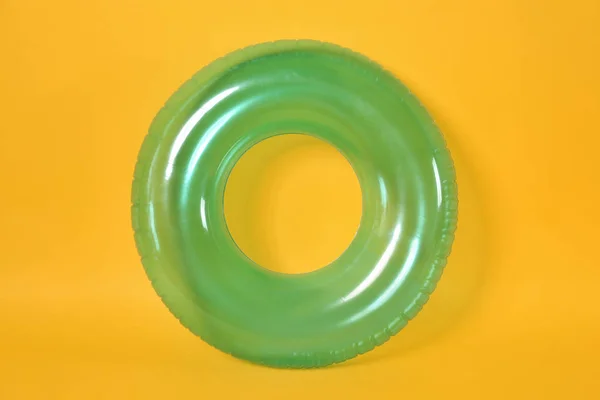 Inflatable ring on color background — Stock Photo, Image