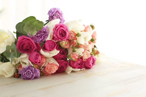 Bouquet of beautiful flowers on table — Stock Photo, Image