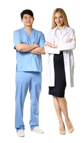 Female doctor and male medical assistant on white background — Stock Photo, Image