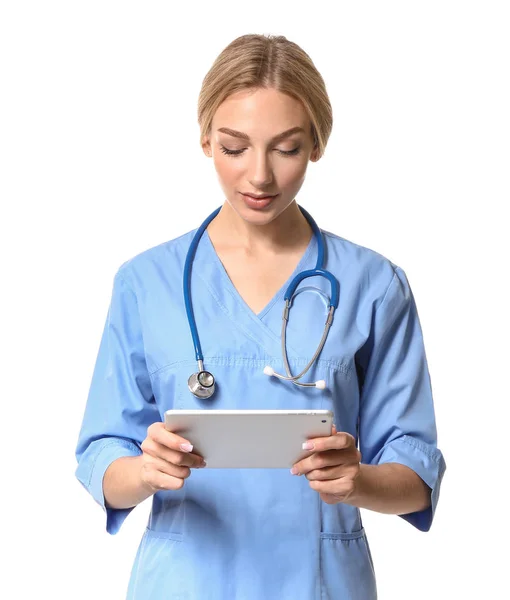 Female medical assistant with tablet computer on white background — Stock Photo, Image