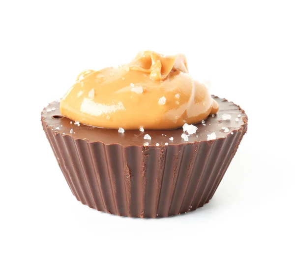 Tasty chocolate peanut butter cup on white background