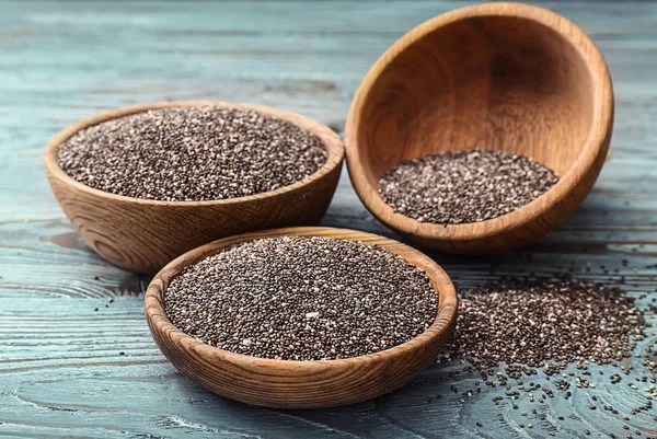 Bowls with chia seeds on wooden table — Stock Photo, Image