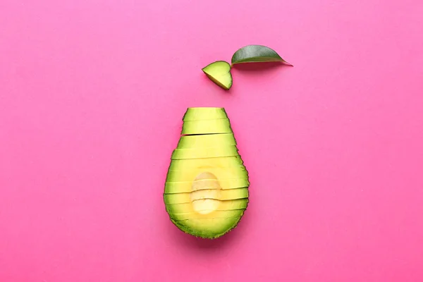 Cut half of avocado on color background — Stock Photo, Image