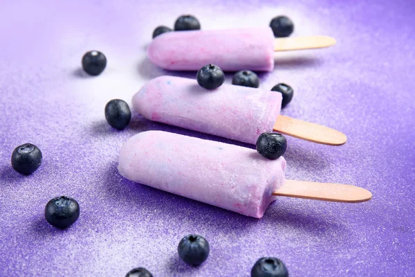 Tasty ice cream with berries on color background — Stock Photo, Image