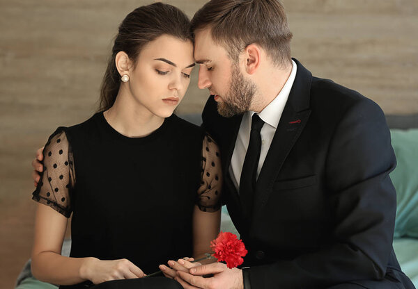 Couple pining after their relative after funeral