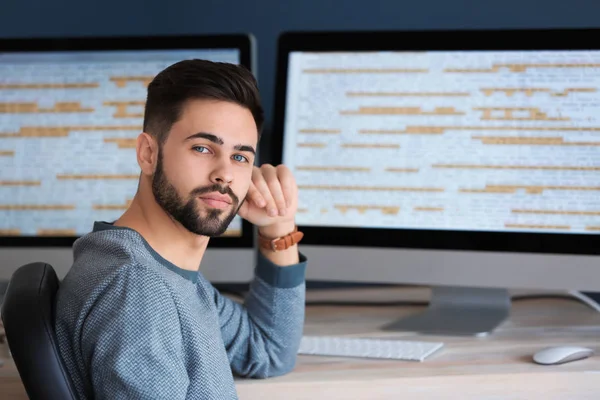 Male programmer working in office