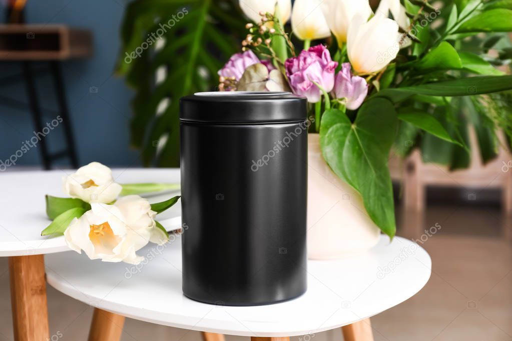 Mortuary urn on table in room