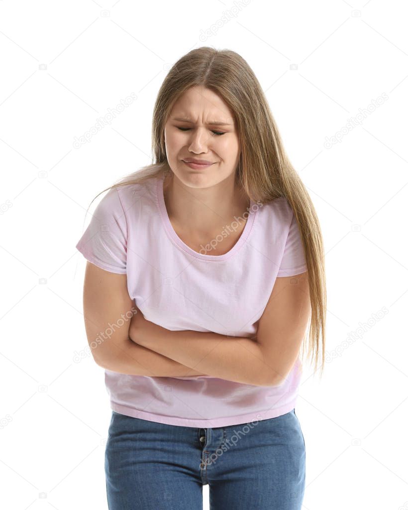 Young woman suffering from abdominal pain on white background