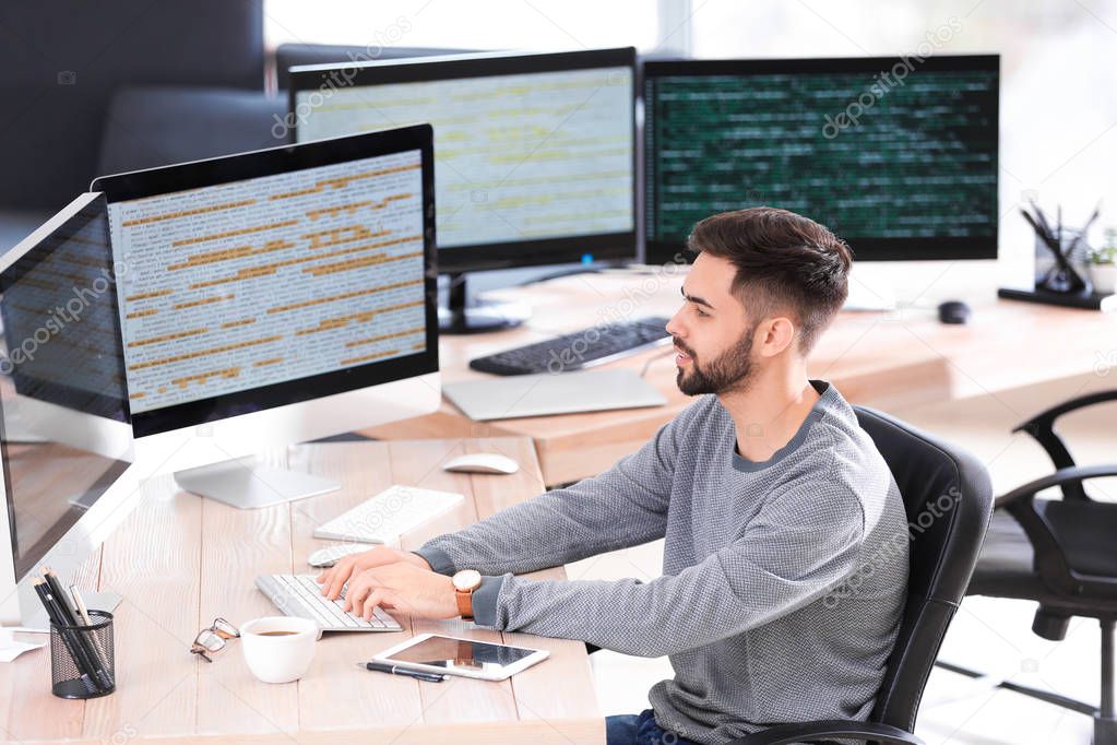 Male programmer working in office