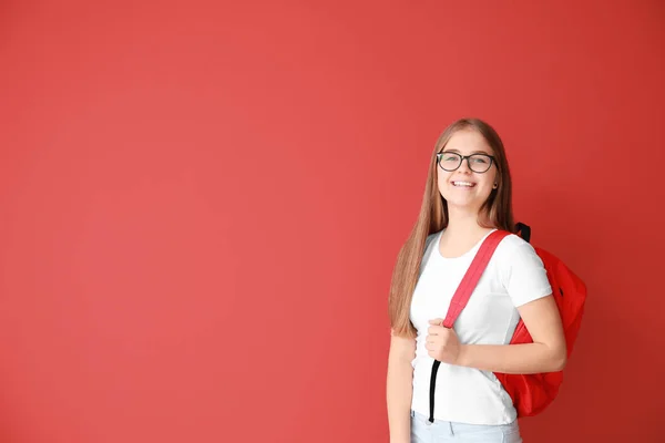 Cute teenage girl on color background — Stock Photo, Image