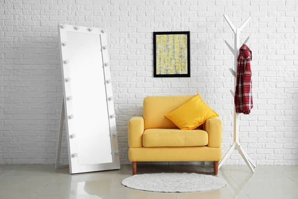 Interior of modern room with comfortable armchair and mirror — Stock Photo, Image