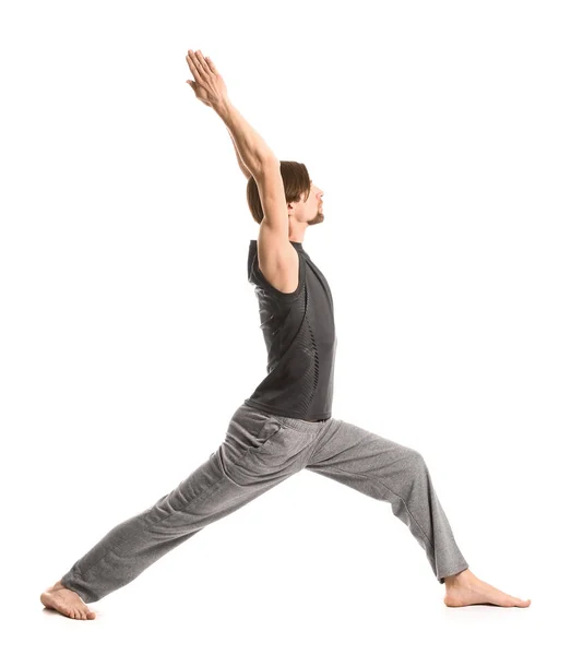 Sporty man practicing yoga on white background — Stock Photo, Image
