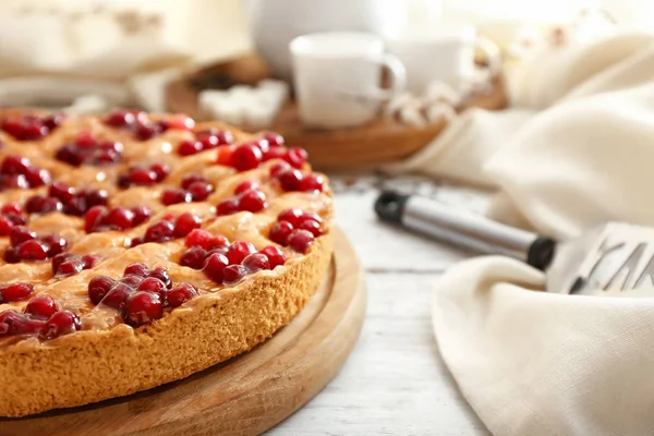 Tasty cranberry pie on table, closeup