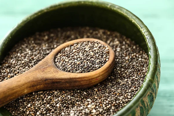 Spoon and bowl with chia seeds on table, closeup — Stock Photo, Image