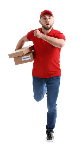 Executando homem de entrega com caixas no fundo branco — Fotografia de Stock