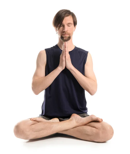 Sporty man practicing yoga on white background — Stock Photo, Image