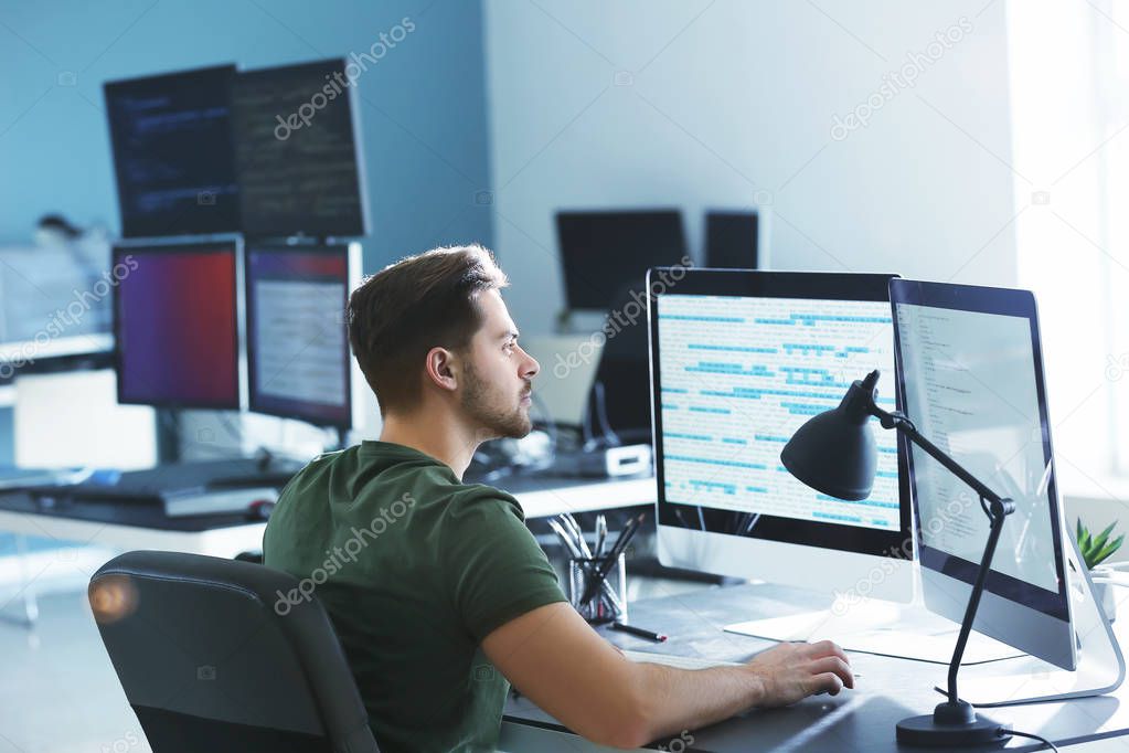 Male programmer working in office