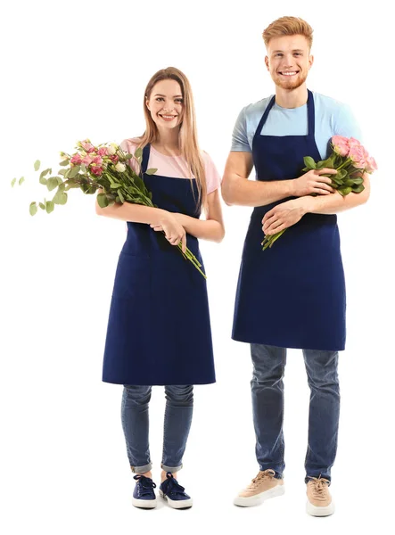 Manliga och kvinnliga florister på vit bakgrund — Stockfoto