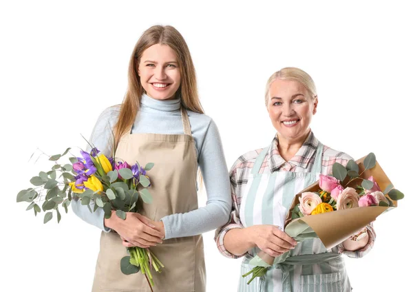 Female florists with bouquets on white background — Stock Photo, Image
