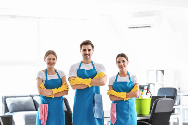 Team of janitors in office