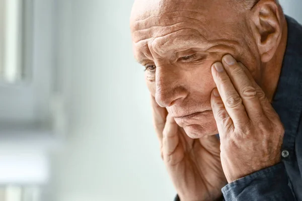 Depressed senior man at home — Stock Photo, Image