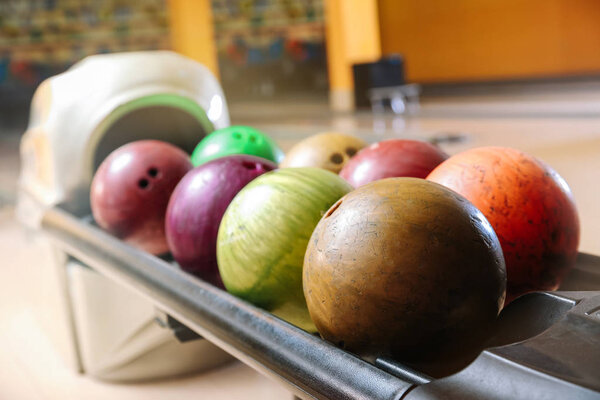 Stand with balls in bowling club