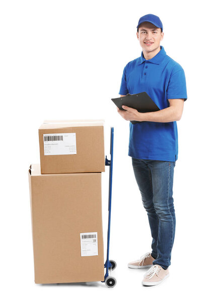 Delivery man with boxes and clipboard on white background