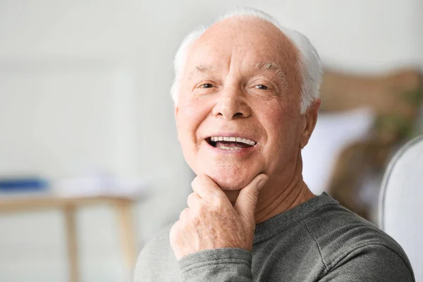 Portrait of elderly man at home — Stock Photo, Image