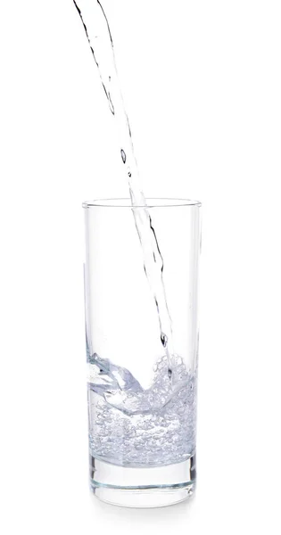 Pouring of fresh water into glass on white background — Stock Photo, Image