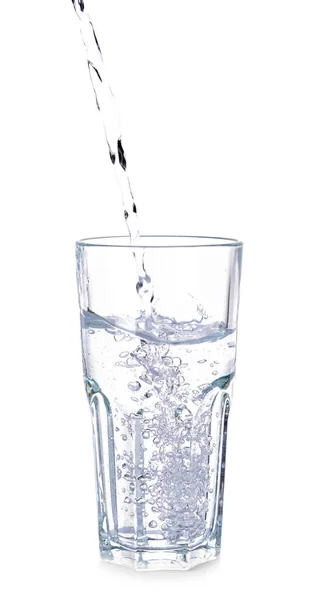 Pouring of fresh water into glass on white background — Stock Photo, Image