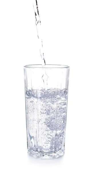 Pouring of fresh water into glass on white background — Stock Photo, Image