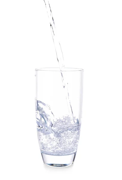 Pouring of fresh water into glass on white background — Stock Photo, Image
