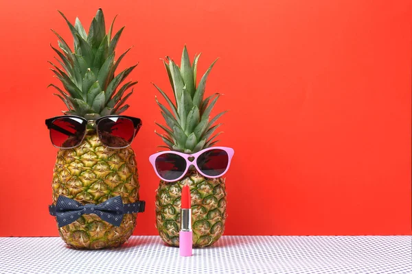 Creative composition with pineapples on color background — Stock Photo, Image