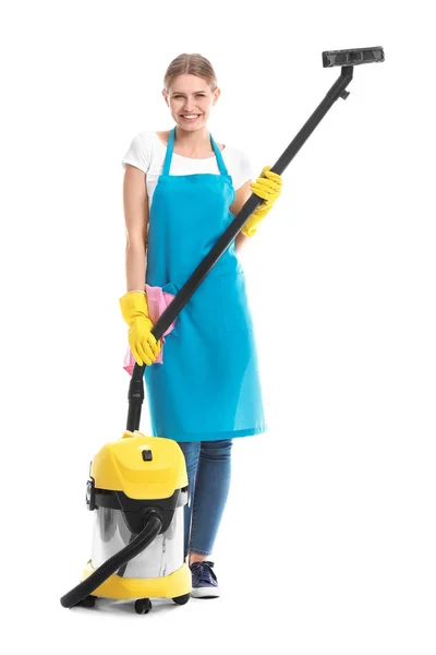 Janitor feminino com aspirador de pó no fundo branco — Fotografia de Stock
