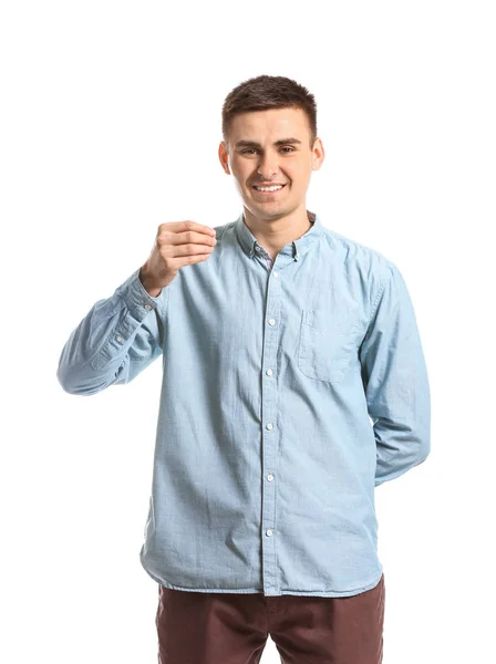Молодий глухий німий чоловік використовує мову жестів на білому тлі — стокове фото