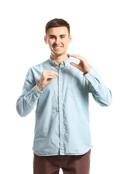 Jovem surdo mudo usando linguagem de sinais no fundo branco — Fotografia de Stock