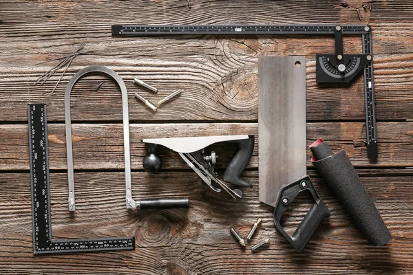 Set of carpenter's tools on wooden background — Stock Photo, Image