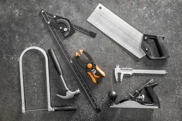 Set of carpenter's tools on grey background — Stock Photo, Image